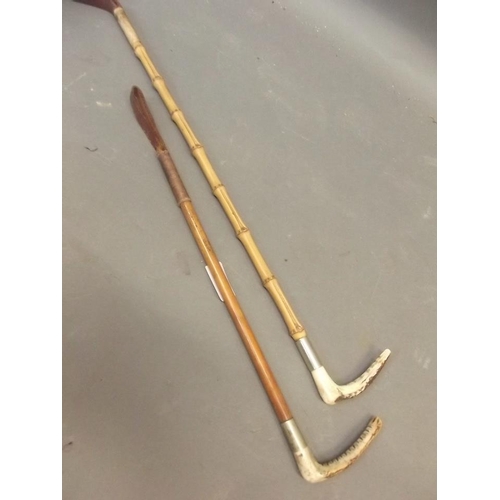 50T - A child's cane, together with a horn handled riding crop, and another similar, 19