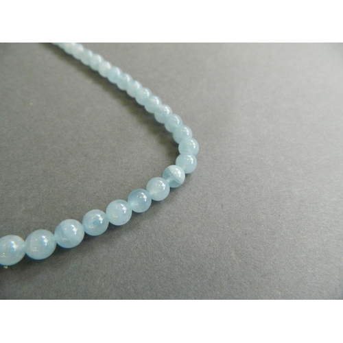 538 - A string of aquamarine style beads, 18