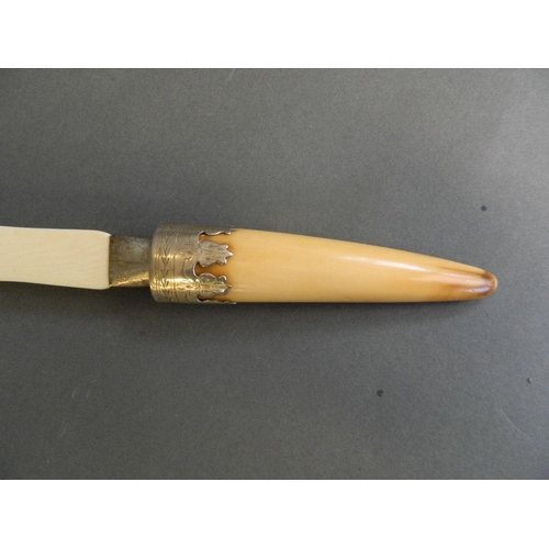 543 - A Hallmarked silver mounted ivory page turner with a horn handle, 13½