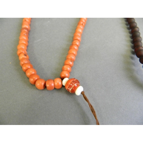 559 - A horn style bead necklace, together with a coral style bead necklace, longest 35