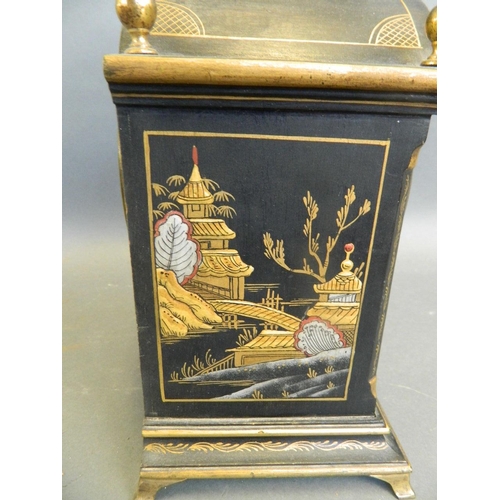 560 - A 1920s black lacquered wood mantle clock with chinoiserie decoration, 7½