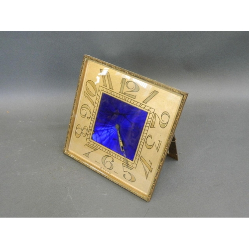 561 - An Art Deco brass eight day easel mantle clock with blue enamelled engine turned decoration, 8