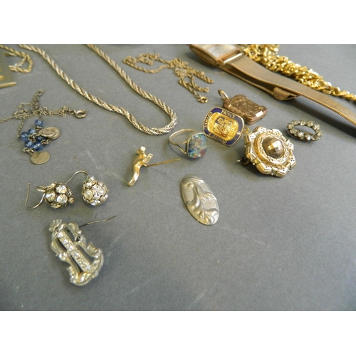 562 - A quantity of assorted costume jewellery comprising 18ct gold plated wristwatch, chains, pendants et... 