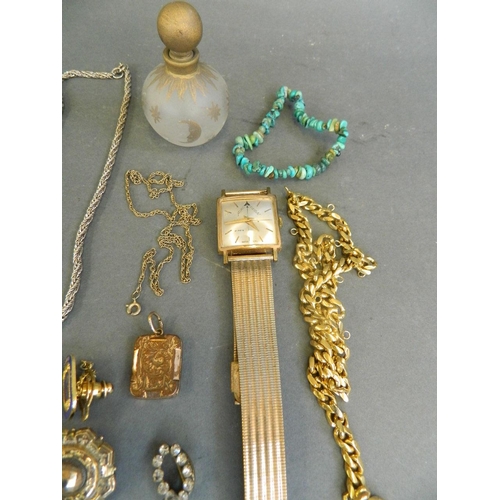 562 - A quantity of assorted costume jewellery comprising 18ct gold plated wristwatch, chains, pendants et... 