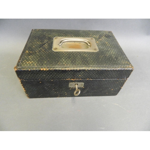 563 - A Victorian leather covered jewellery box with tray and key, containing a collection of costume jewe... 