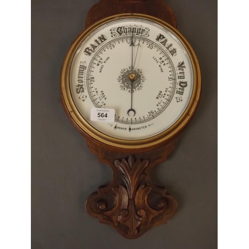 564 - A Victorian carved oak cased aneroid barometer, 32