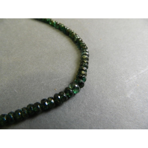 573 - A three strand coral necklace, together with a graduated emerald shard necklace, longest 22