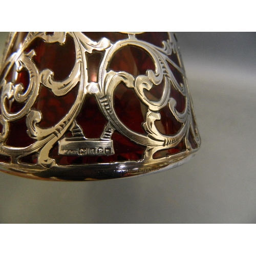 574 - A Hallmarked silver cased cranberry glass decanter, London 1899/1900, bears import marks '999/1000 F... 