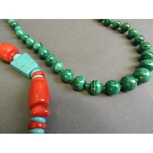 579 - A collection of semi-precious stone necklaces to include malachite, coral, turquoise, and jade, toge... 