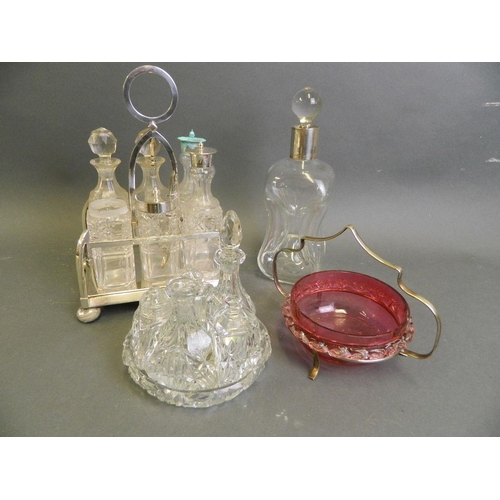 583 - A Dimple decanter with Hallmarked silver collar, together with a silver plate, six bottle glass crue... 