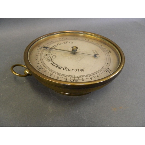 589 - A brass cased barometer by 'Davis, Leeds', 6