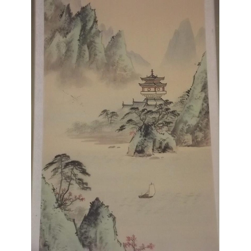 650N - A set of three Chinese prints on silk, mountainous landscapes with pagodas, 27