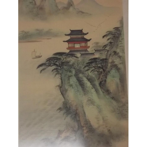 650N - A set of three Chinese prints on silk, mountainous landscapes with pagodas, 27