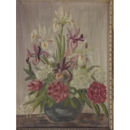 698 - A mid C20th oil on panel, still life with vase of flowers, and an oil sketch on paper of rocks and s... 