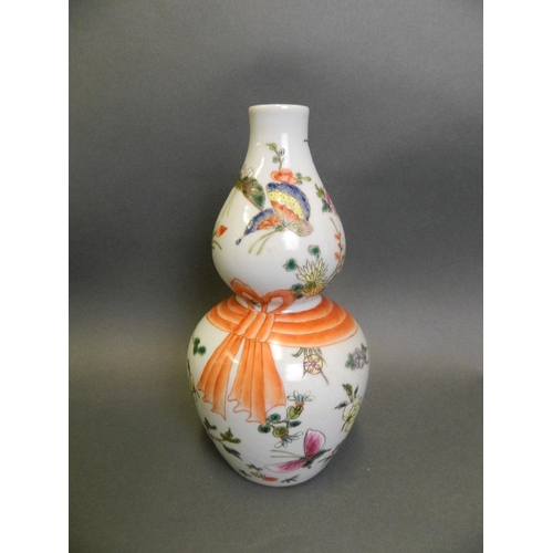 7 - A Chinese polychrome enamel porcelain double gourd vase decorated with butterflies, 6 character mark... 