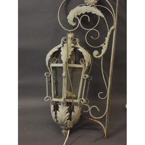 701 - A pair of painted wrought steel lanterns, 34