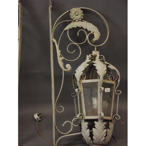 701 - A pair of painted wrought steel lanterns, 34