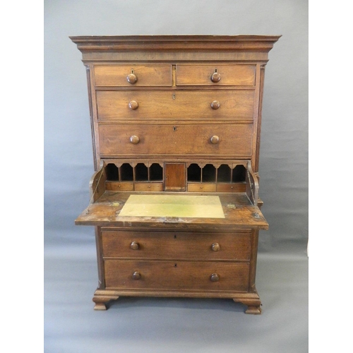 705 - A George III mahogany chest on chest, the upper section with fitted secretaire and four drawers flan... 