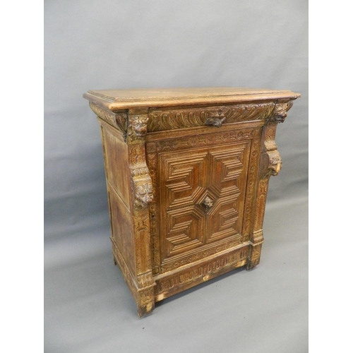 707 - A C19th French/Flemish carved oak cupboard with single drawer over cupboard, with lion mask decorati... 