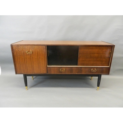 710 - A 1960s Gomme mahogany sideboard with sliding doors over two drawers and a fall front cupboards, rai... 