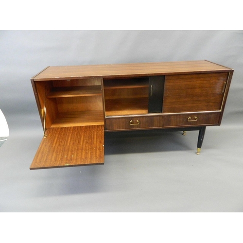 710 - A 1960s Gomme mahogany sideboard with sliding doors over two drawers and a fall front cupboards, rai... 