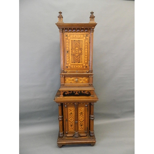 713 - A C19th Italian oak two section cabinet with parquetry inlaid panels and moulded and beaded decorati... 