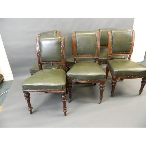 715 - A matched set of six Victorian oak dining chairs with brass studded leatherette covers and carved de... 