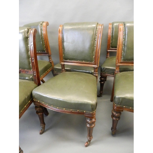 715 - A matched set of six Victorian oak dining chairs with brass studded leatherette covers and carved de... 