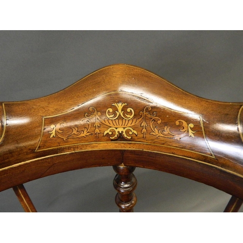 730 - A Victorian inlaid walnut corner chair with shaped back and seat, raised on turned supports united b... 