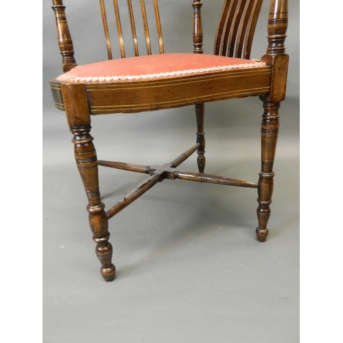 730 - A Victorian inlaid walnut corner chair with shaped back and seat, raised on turned supports united b... 