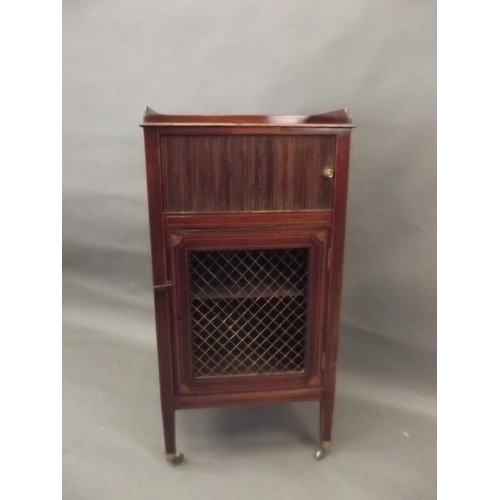 737 - A Victorian inlaid mahogany cabinet with tambour door above a cupboard with brass grill, raised on s... 