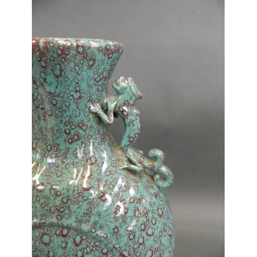 74 - A Chinese turquoise flambé glazed moonflask with twin dragon handles and ribbed decoration, seal mar... 