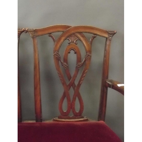 742 - A Victorian Chippendale style two seater settee with carved pierced splat back, raised on cabriole s... 