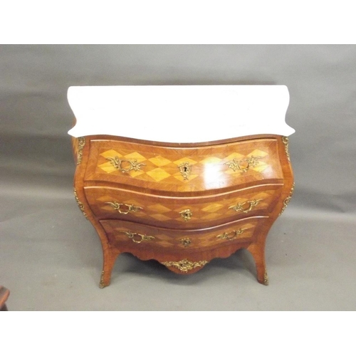 748 - A late C19th/early C20th Swedish bombé shaped three drawer commode with harlequin marquetry decorati... 