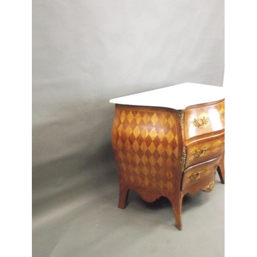 748 - A late C19th/early C20th Swedish bombé shaped three drawer commode with harlequin marquetry decorati... 