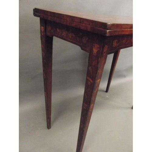 750 - A late C18th/early C19th Dutch mahogany card table with marquetry inlaid decoration of scrolls, flow... 