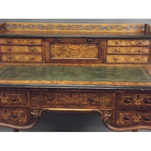 753 - A C19th figured walnut desk with fine boxwood inlaid decoration of scrolls, exotic birds and coronet... 