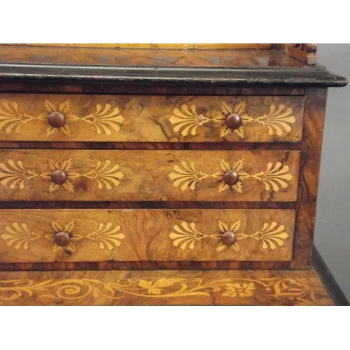 753 - A C19th figured walnut desk with fine boxwood inlaid decoration of scrolls, exotic birds and coronet... 