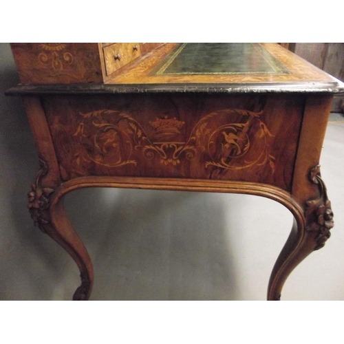 753 - A C19th figured walnut desk with fine boxwood inlaid decoration of scrolls, exotic birds and coronet... 