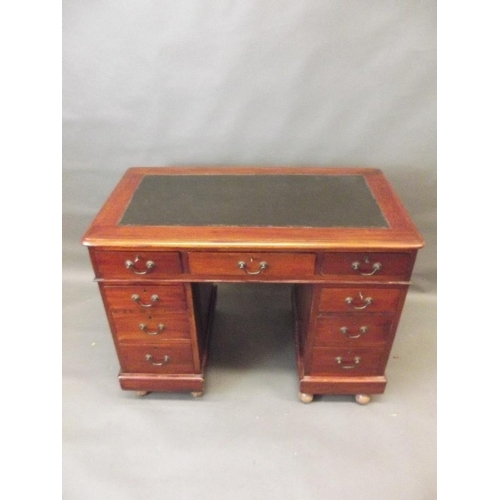 770 - A late Victorian mahogany nine drawer pedestal desk with inset top, 42