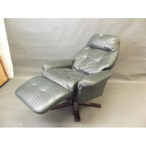 771 - A leather reclining and swivel chair with foot rest