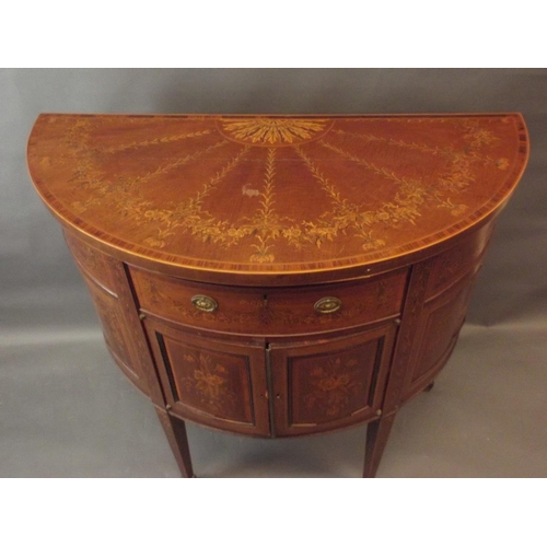 776 - A C19th figured mahogany demi-lune side cabinet with Adam style penwork inlaid decoration of swags, ... 