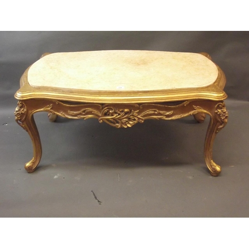 779 - A giltwood occasional table with carved decoration and inset marble top, raised on cabriole supports... 