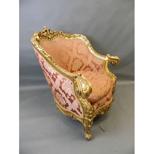 781 - A pair of giltwood easy chairs with carved and pierced frames and scrolled arms, with shaped fronts,... 