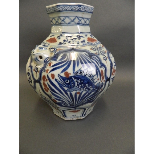 79 - A Chinese Ming style blue and white vase of octagonal form with twin mask handles, decorated with dr... 