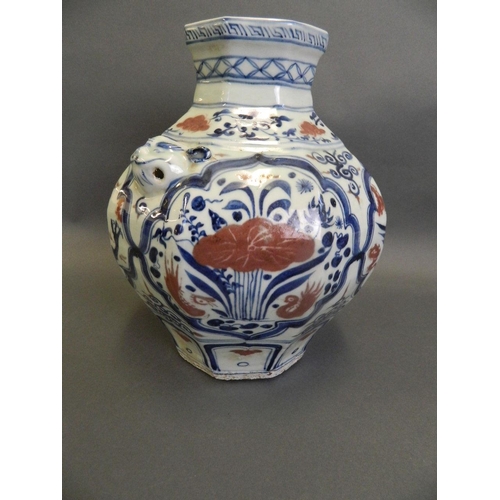 79 - A Chinese Ming style blue and white vase of octagonal form with twin mask handles, decorated with dr... 