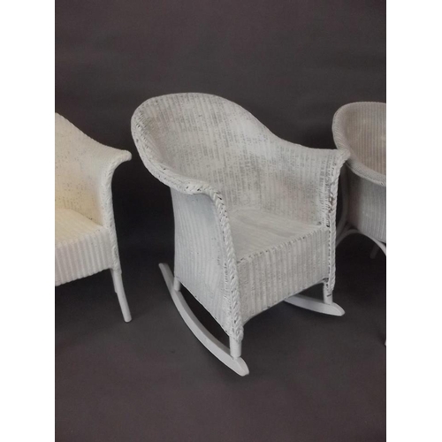 799 - A pair of Lloyd Loom chairs, and a rocking chair