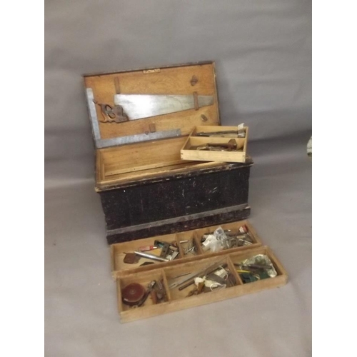 808 - A C19th pine tool chest with filled compartments containing old saws, planes, tools etc, 37