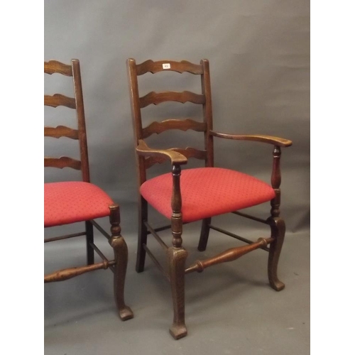 812 - A set of six oak ladderback chairs raised on shaped supports