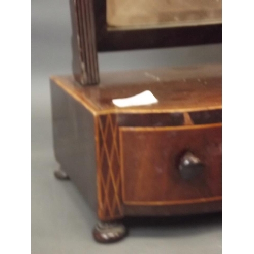 821 - A George III inlaid mahogany three drawer swing toilet mirror, and another smaller, 21